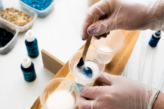 Artist creating resin art